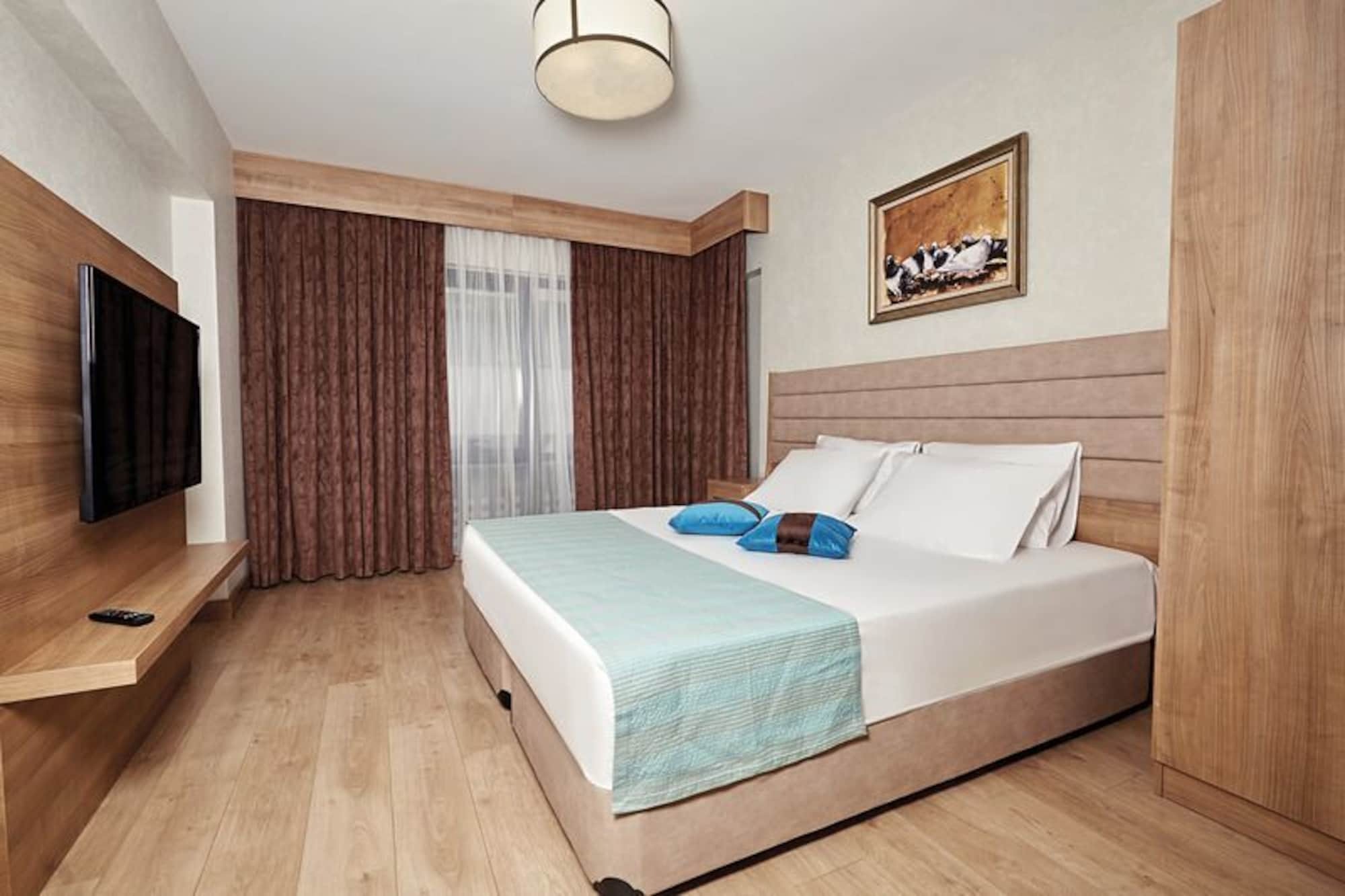 Bursa Suites Apart Otel Extérieur photo A bedroom in a hotel